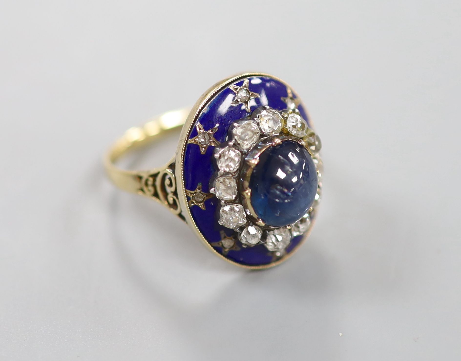 A 19th century French yellow metal (18ct poincon mark), cabochon sapphire, rose and old cut diamond and blue enamel set oval dress ring